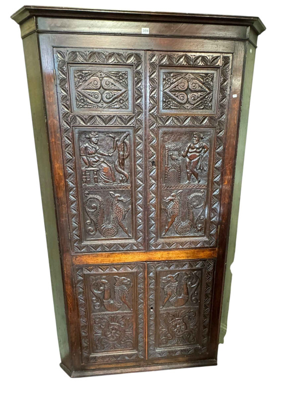 Victorian carved oak four door standing corner cabinet, 196cm.