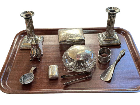Pair of silver candlesticks, silver cigarette box, silver pepperette,...
