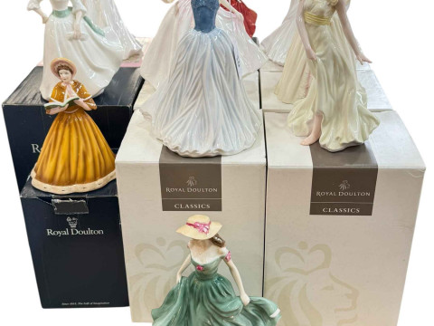 Ten Royal Doulton lady figures.