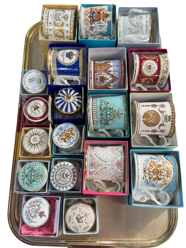 Collection of boxed commemorative mugs and pill boxes.