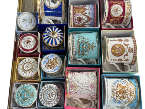 Collection of boxed commemorative mugs and pill boxes.