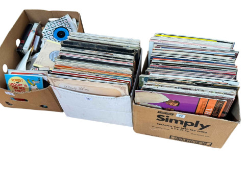 Three boxes of LP and single records.