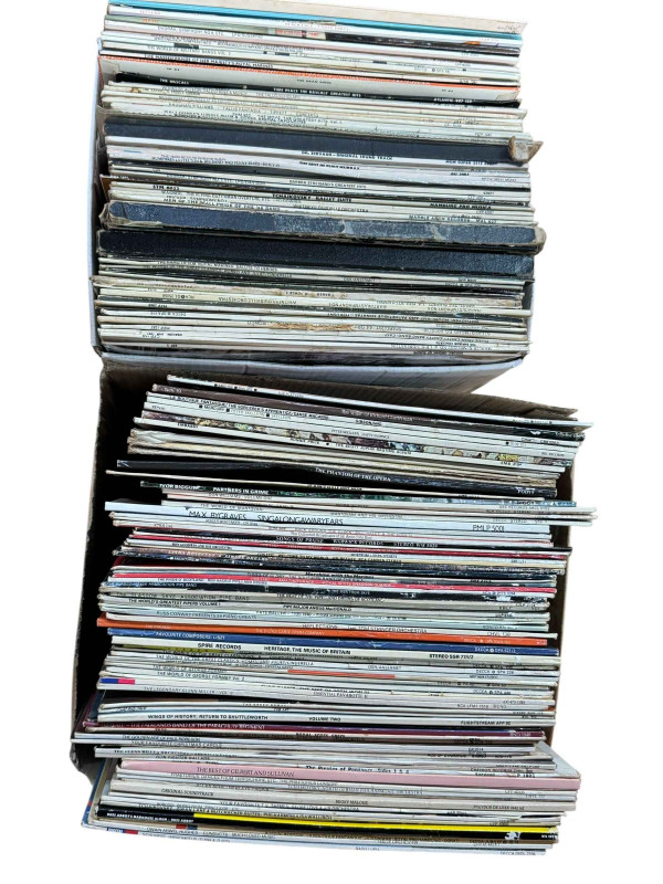 Three boxes of LP and single records.