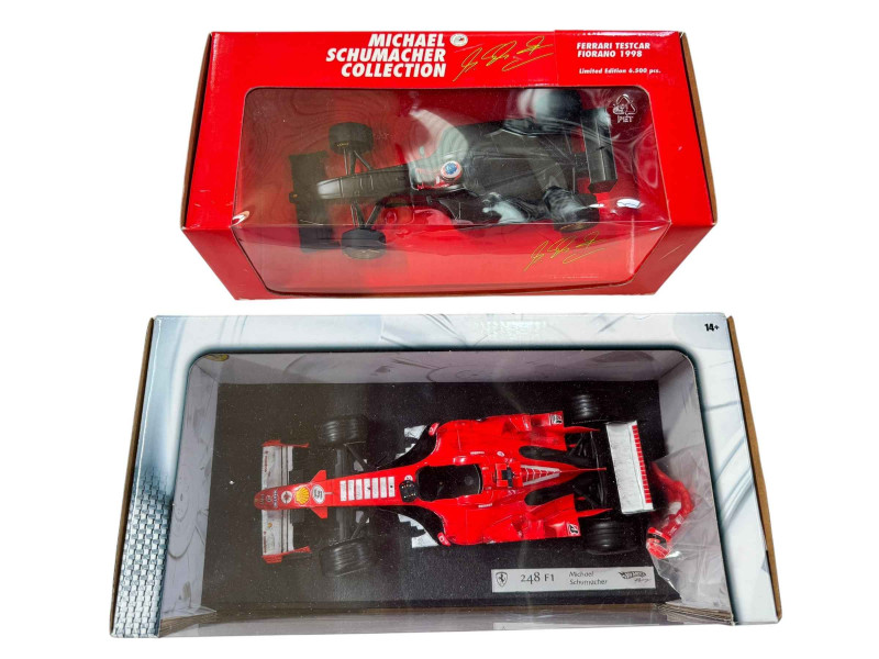Four various Michael Schumacher limited edition F1 model vehicles.