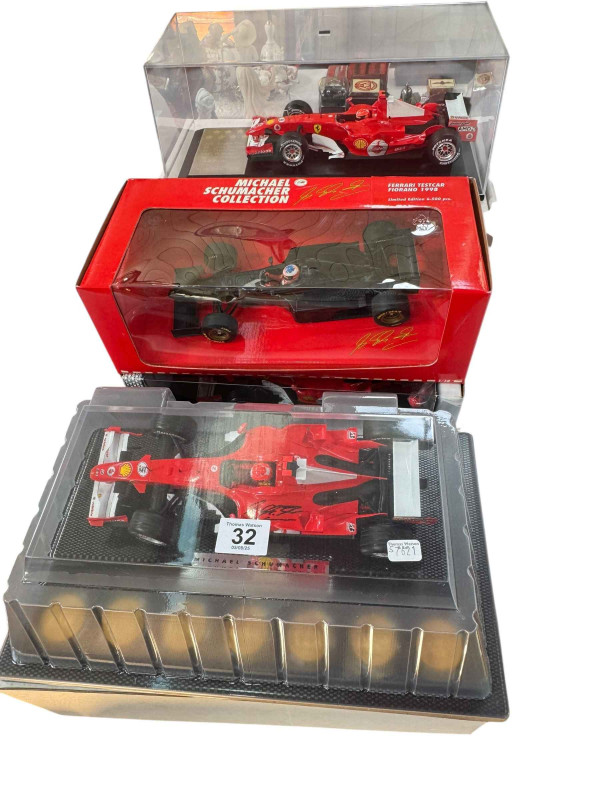 Four various Michael Schumacher limited edition F1 model vehicles.