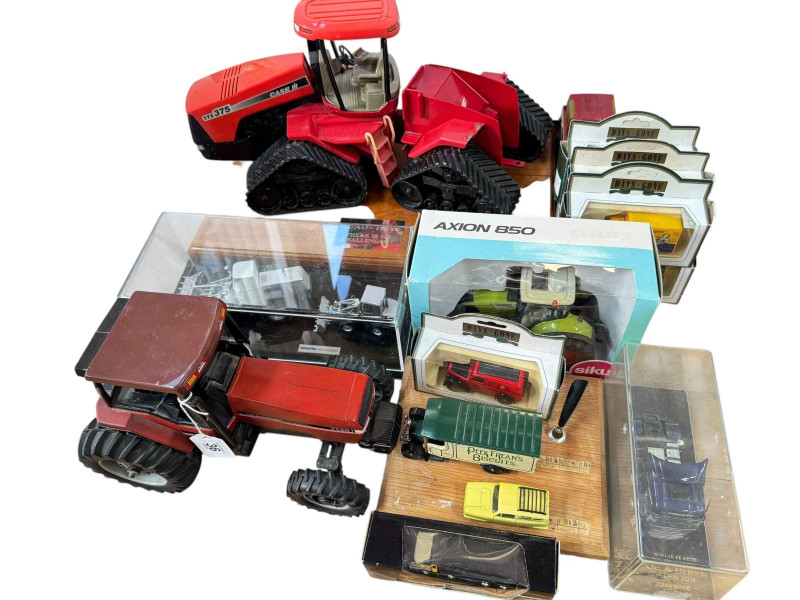 Model tractors, Quad Trac model, Komatsu Millenium edition and other model vehicles.