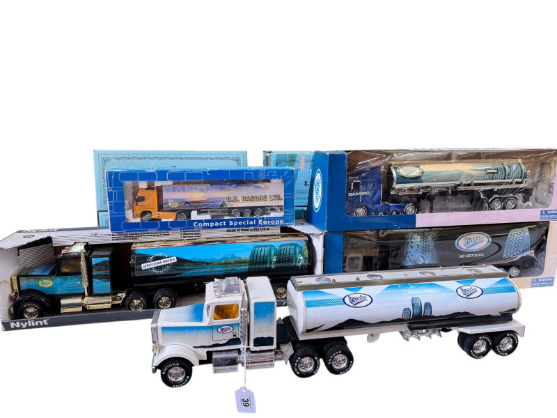 Five assorted Bandag model articulated lorry models.