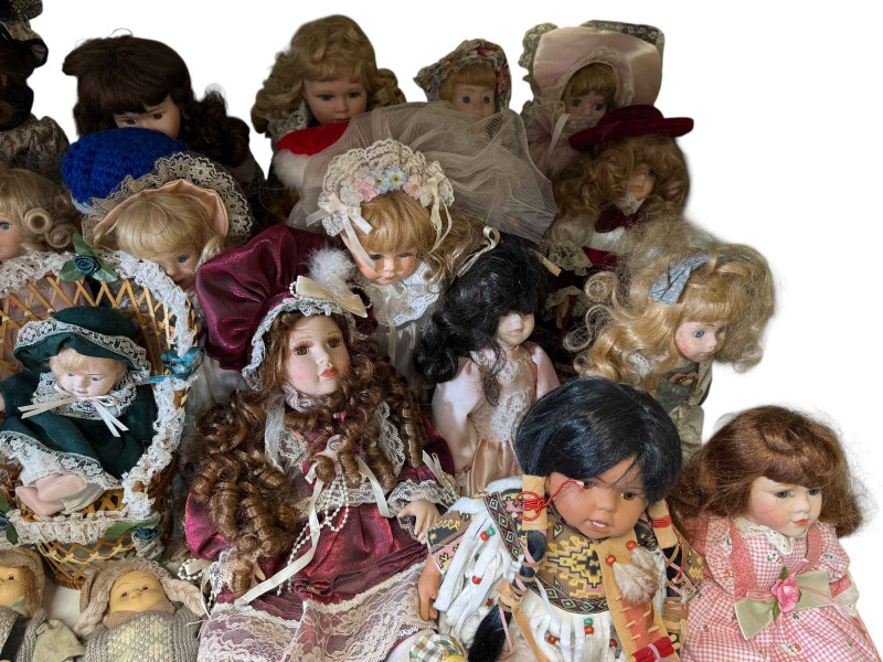 Collection of various pot head dolls.