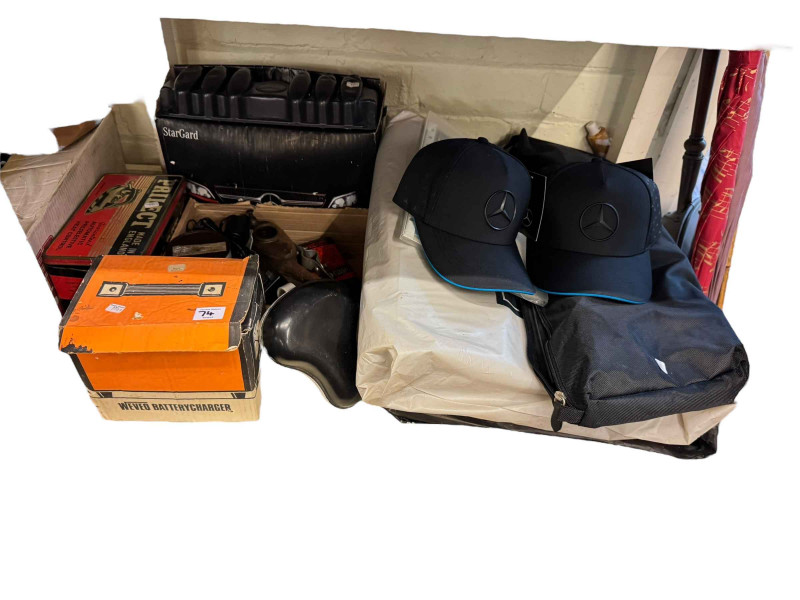 Collection of car accessories and memorabilia including brochures, vintage oil can, Mercedes caps, etc.