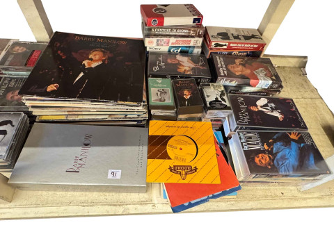 Good collection of Barry Manilow memorabilia including snapshot photographs, tickets, brochures, calendars, pens, along with signed CD's, LP records, cassette tapes, together with Manilow t-shirts. thumbnail