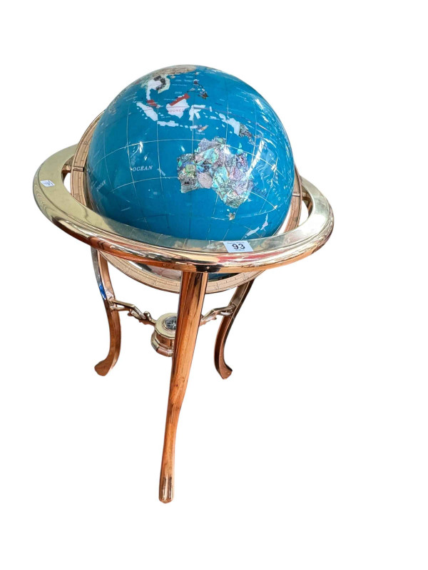 Semi-precious finish terrestrial globe on gilt metal stand with inset compass.
