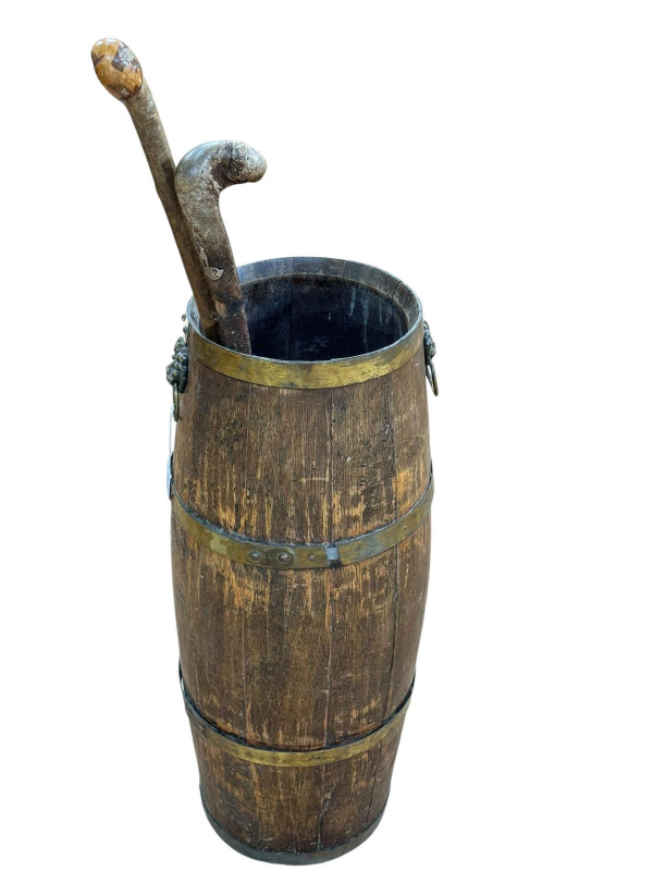 Coopered barrel stick stand and walking sticks.