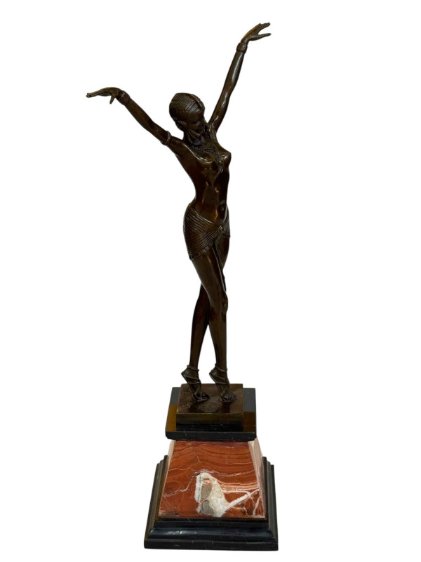Art Deco style bronze lady in pose on marble plinth, 54cm high.