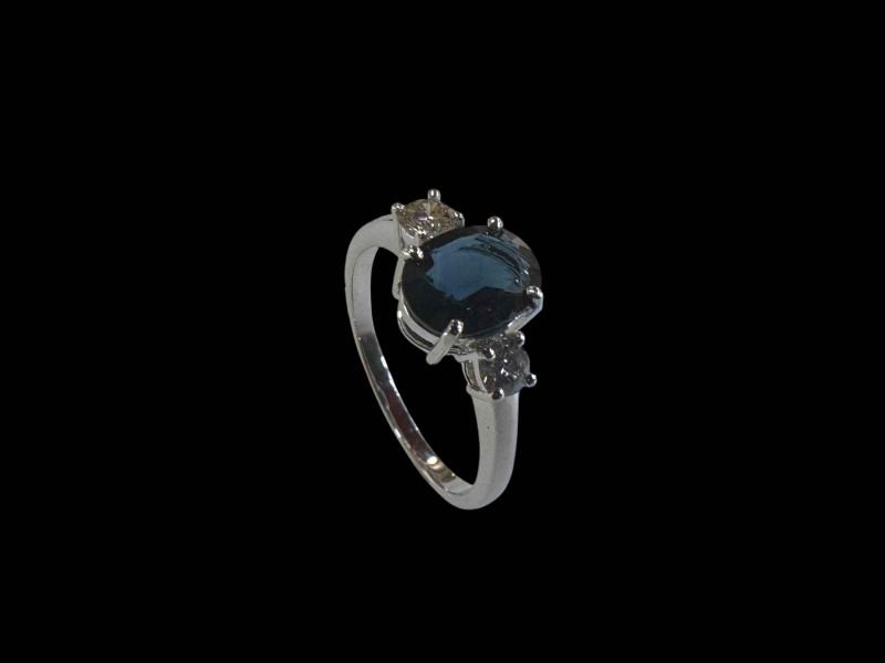 Sapphire and diamond three stone ring set in 18 carat white gold, size O.