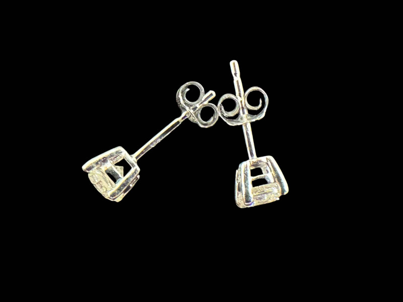 Pair of 18 carat white gold and diamond stud earrings.