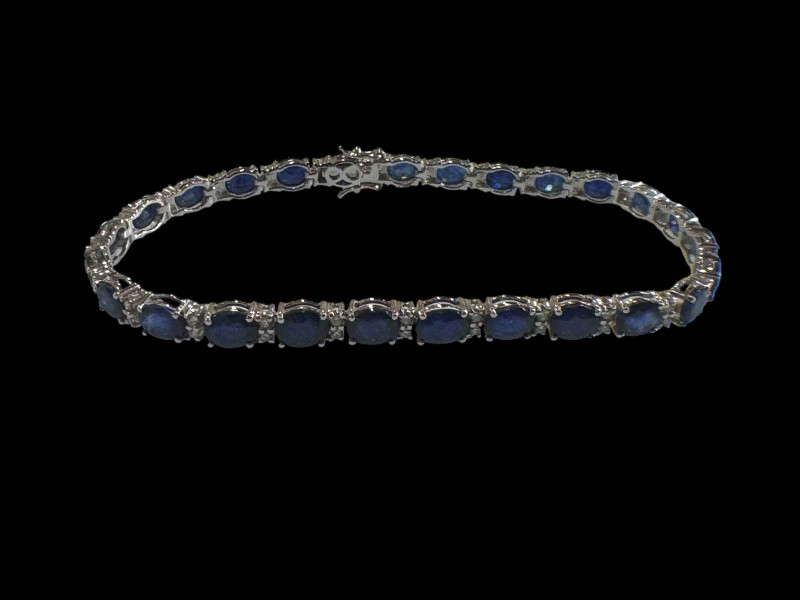 Sapphire and diamond bracelet set in 18 carat white gold, sapphires totalling 9.50 carats and 0.48 carats of diamonds.