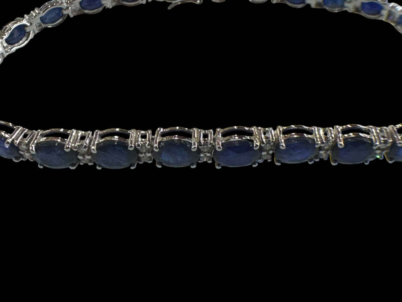 Sapphire and diamond bracelet set in 18 carat white gold, sapphires totalling 9.50 carats and 0.48 carats of diamonds.