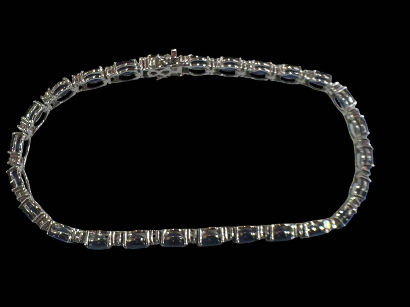 Sapphire and diamond bracelet set in 18 carat white gold, sapphires totalling 9.50 carats and 0.48 carats of diamonds.