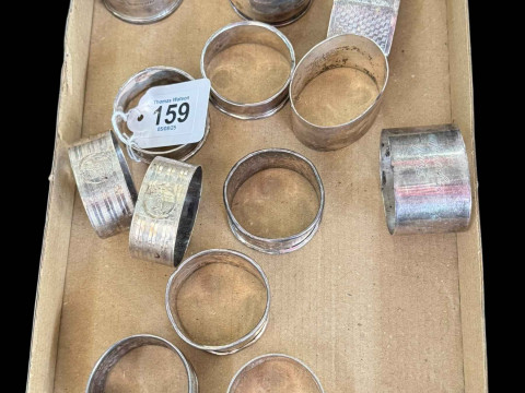 Collection of thirteen silver napkin rings.