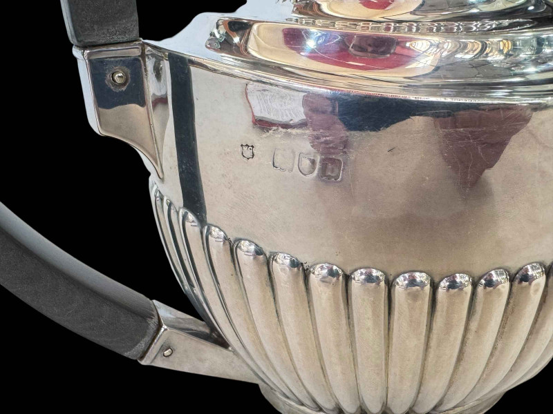 Silver part fluted oval teapot, London 1897.