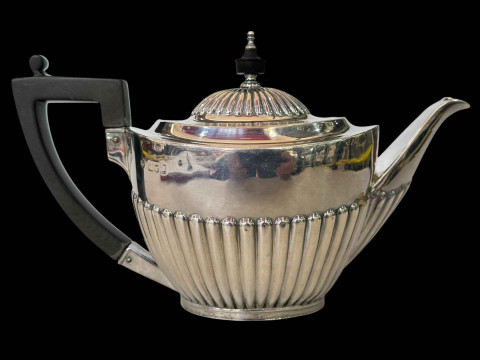 Silver part fluted oval teapot, London 1897.