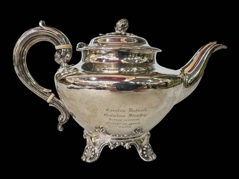 Victorian silver teapot on scroll feet, London 1845.