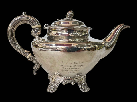 Victorian silver teapot on scroll feet, London 1845.