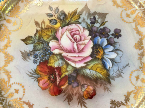 Two Aynsley plates signed J A Bailey, centrally decorated with roses, gilt and blue decorated borders. thumbnail