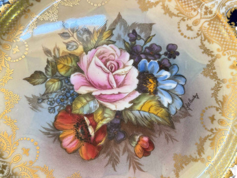 Two Aynsley plates signed J A Bailey, centrally decorated with roses, gilt and blue decorated borders. thumbnail