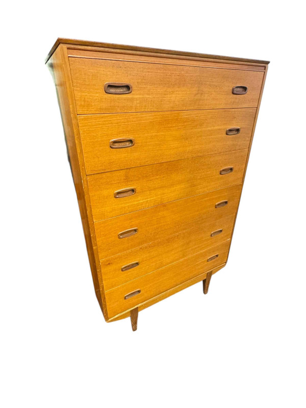 Mid Century teak chest of six long drawers, 122cm by 86.5cm by 46cm.