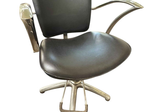 Adjustable chrome and black leather? Barbers chair.