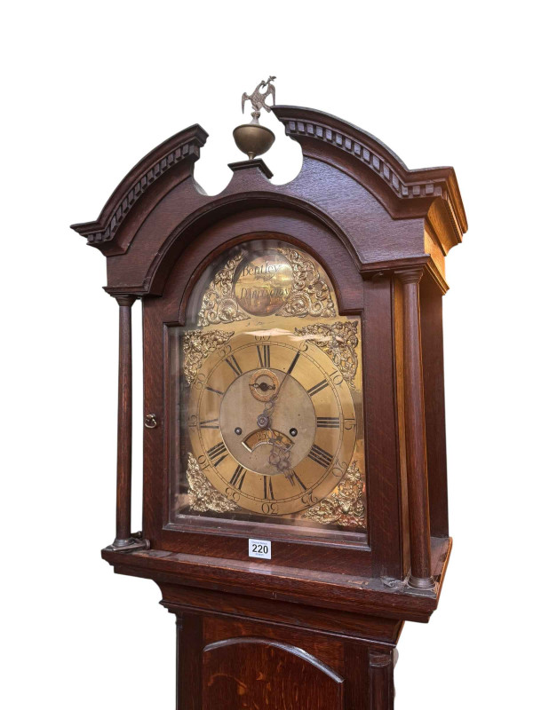 Antique oak eight day longcase clock having brass arched dial, signed Bentley, Darlington, 227cm.