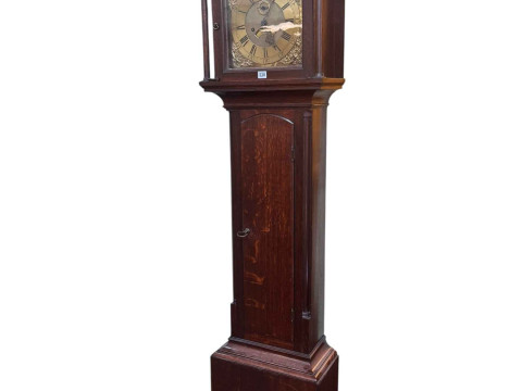 Antique oak eight day longcase clock having brass arched dial, signed...