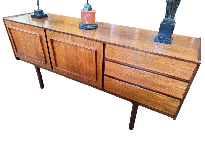 A H McIntosh & Co vintage rosewood eight piece dining suite comprising long john sideboard 772cm by 170cm by 45cm, rectangular extending dining table with two integral leaves 74cm by 92cm by 159.5cm excluding leaves and set of six dining chair including one carver.