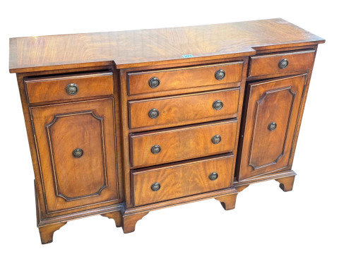 Mahogany crossbanded breakfront side cabinet having four central drawers...