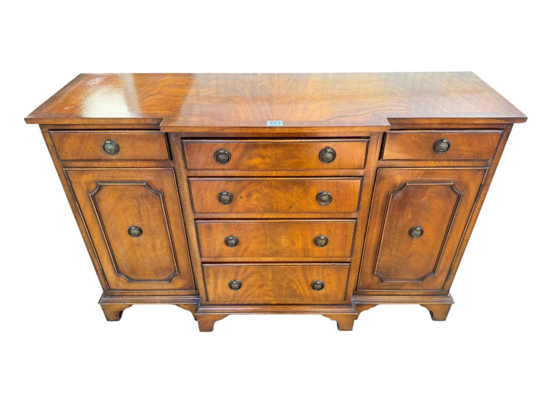 Mahogany crossbanded breakfront side cabinet having four central drawers flanked by two drawers and two cupboard doors, 67.5cm by 104.5cm by 33cm.