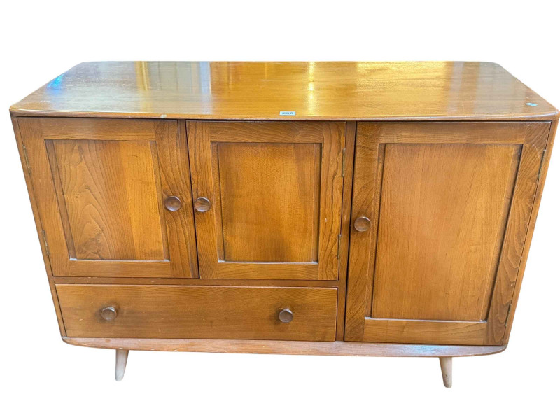 Vintage Ercol Windsor three door sideboard with base drawer, 81cm by 114cm by 51cm.