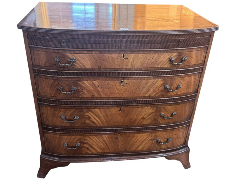 19th Century mahogany bow front Bachelors chest having brush slide above...