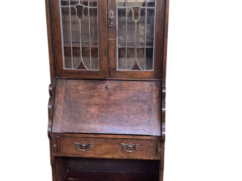 Art Nouveau oak bureau bookcase having two leaded glazed doors above a...