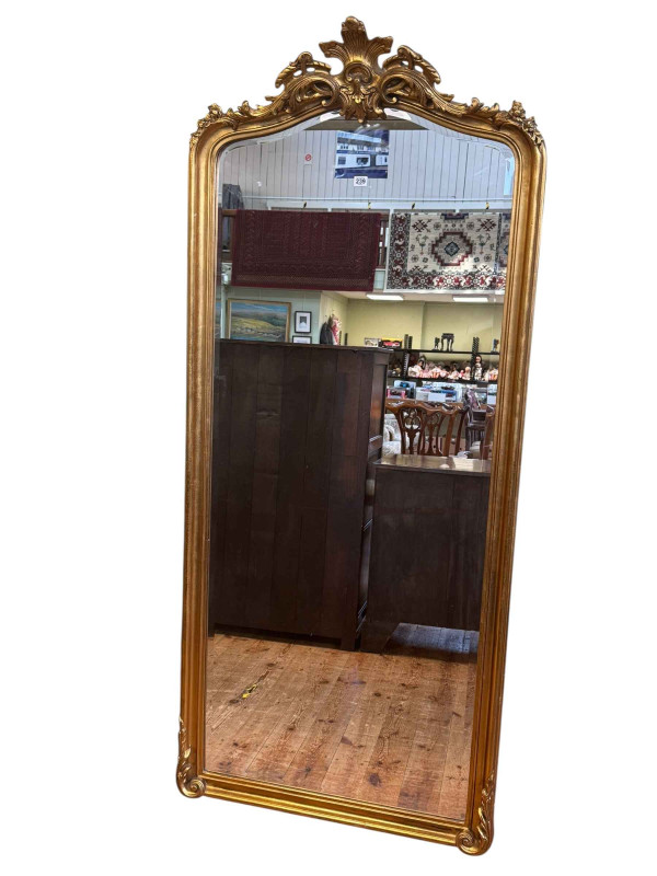 French style rectangular gilt framed arched top bevelled wall mirror, 199cm by 87cm.