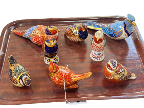 Eight Royal Crown Derby bird paperweights.