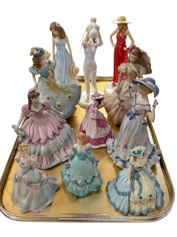 Eight Coalport and three Royal Doulton figures (11).