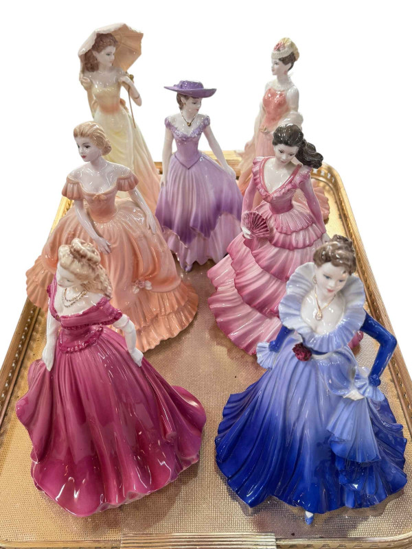 Seven Coalport Ladies of Fashion figures.