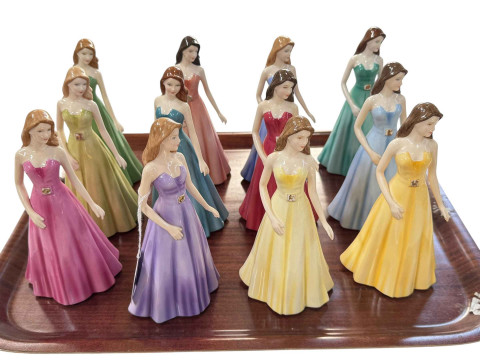 Twelve Royal Doulton Signs of the Zodiac figures.