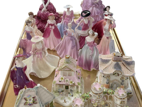 Thirteen Coalport lady figures and four cottages.