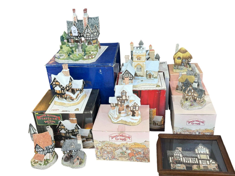 Nine David Winter cottages including Spencer Hall Gardens, Mister Fezziwig's Emporium and Pudding Cottage with boxes and most certificates.