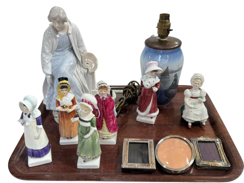 Large Royal Copenhagen artist figure and table lamp, six Royal Doulton figures and three silver photograph frames.