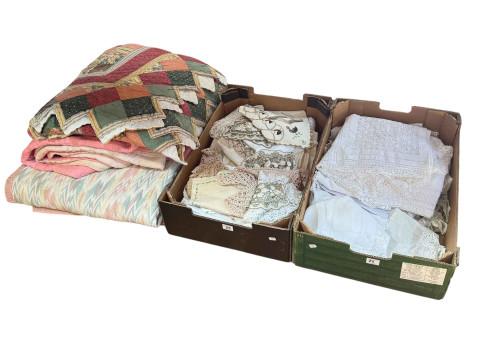 Two boxes of linen and three quilts.