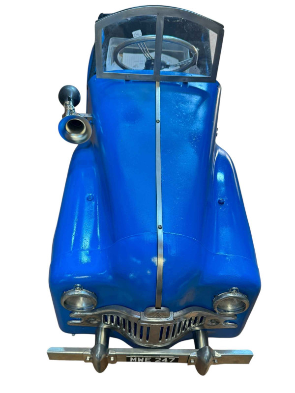 Triang pedal car with battery power.