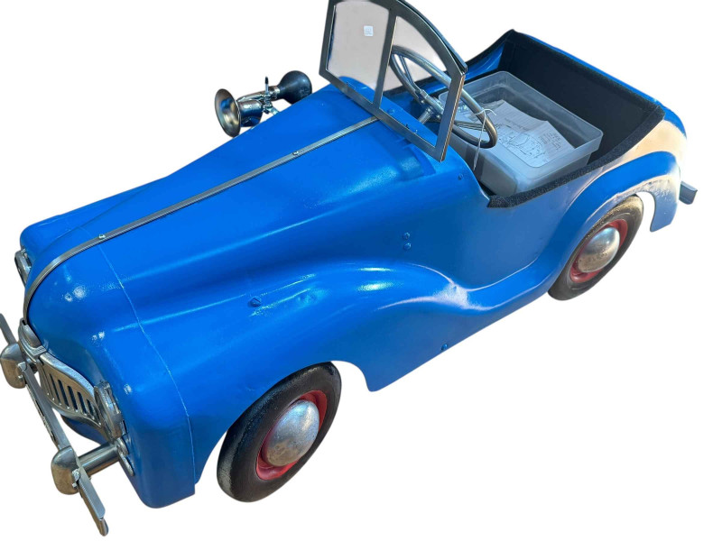 Triang pedal car with battery power.